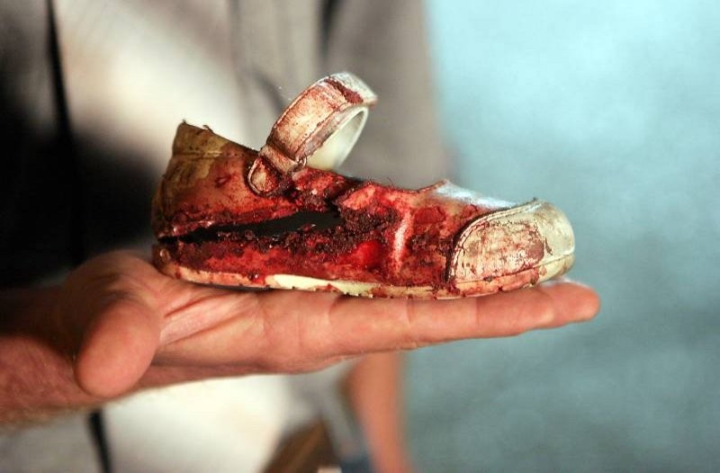 Bloody_child's_shoe_after_rocket_fired_from_Gaza_hit_Israel