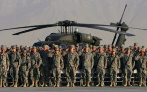 U.S. troops salute during a military ceremony at the Bagram airbase, north of Kabul, September 11, 2006 to commemorate the fifth anniversary of the September 11, 2001 attacks. REUTERS/Ahmad Masood (AFGHANISTAN)